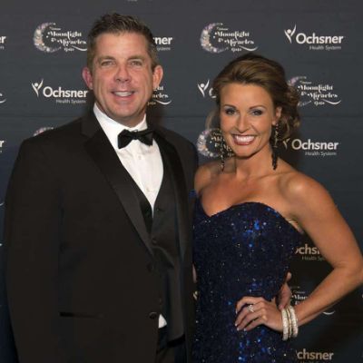 Skylene Montgomery with her husband Sean Payton posing for a photo shoot.